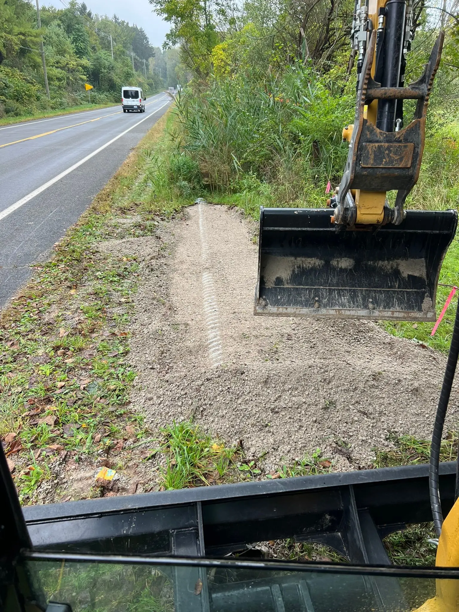 Cleared field and roadside edge maintained by KBK Landscaping in Southeast Michigan