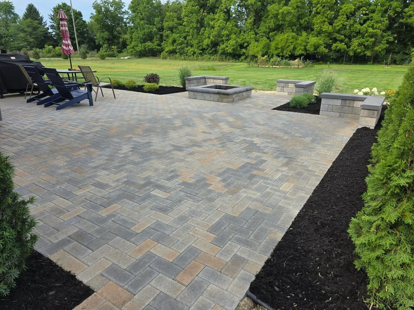 Paver patio and fire feature installed by KBK Landscaping