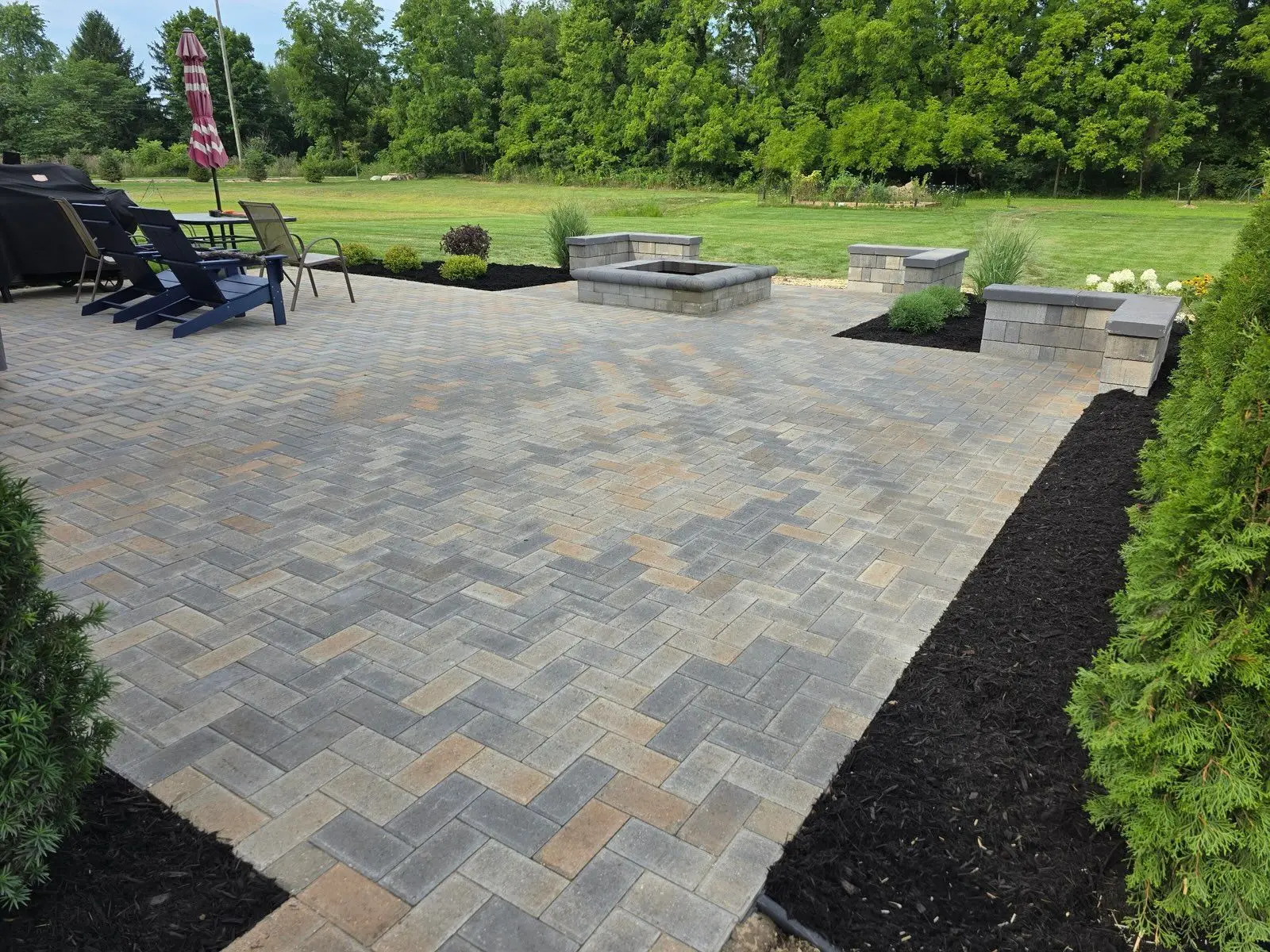 Freshly installed paver patio and mulch bed on a Canton commercial property