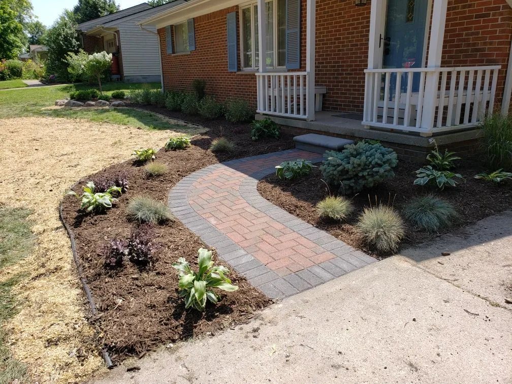 Completed hardscape patio and retaining wall project by KBK