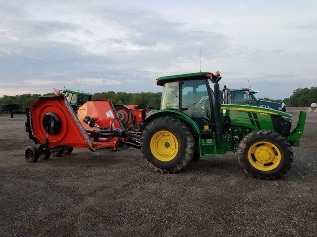 KBK Landscaping tractor and flail mower attachment at the equipment yard