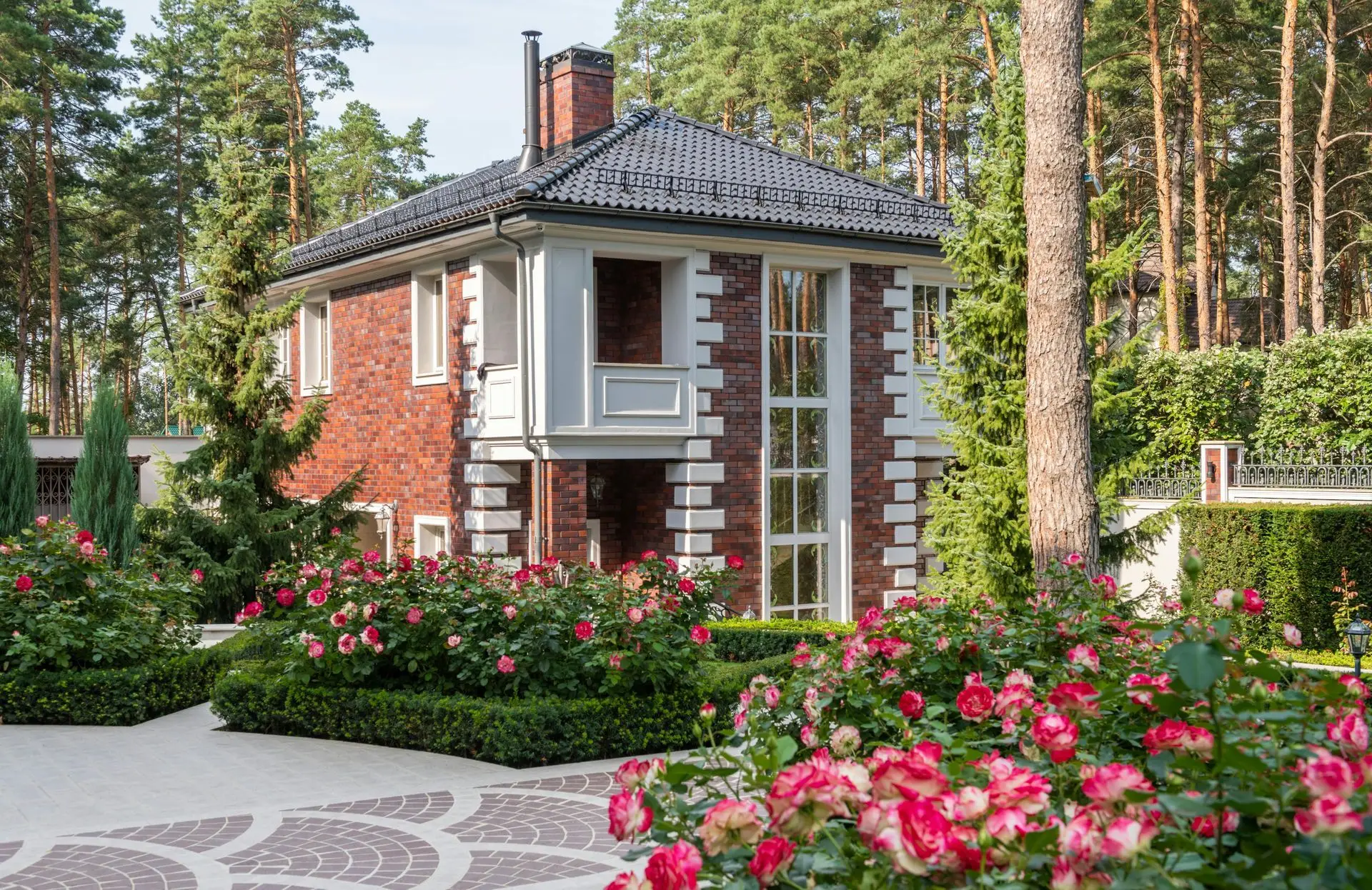 Designed residential landscape with layered plantings and a stone walkway