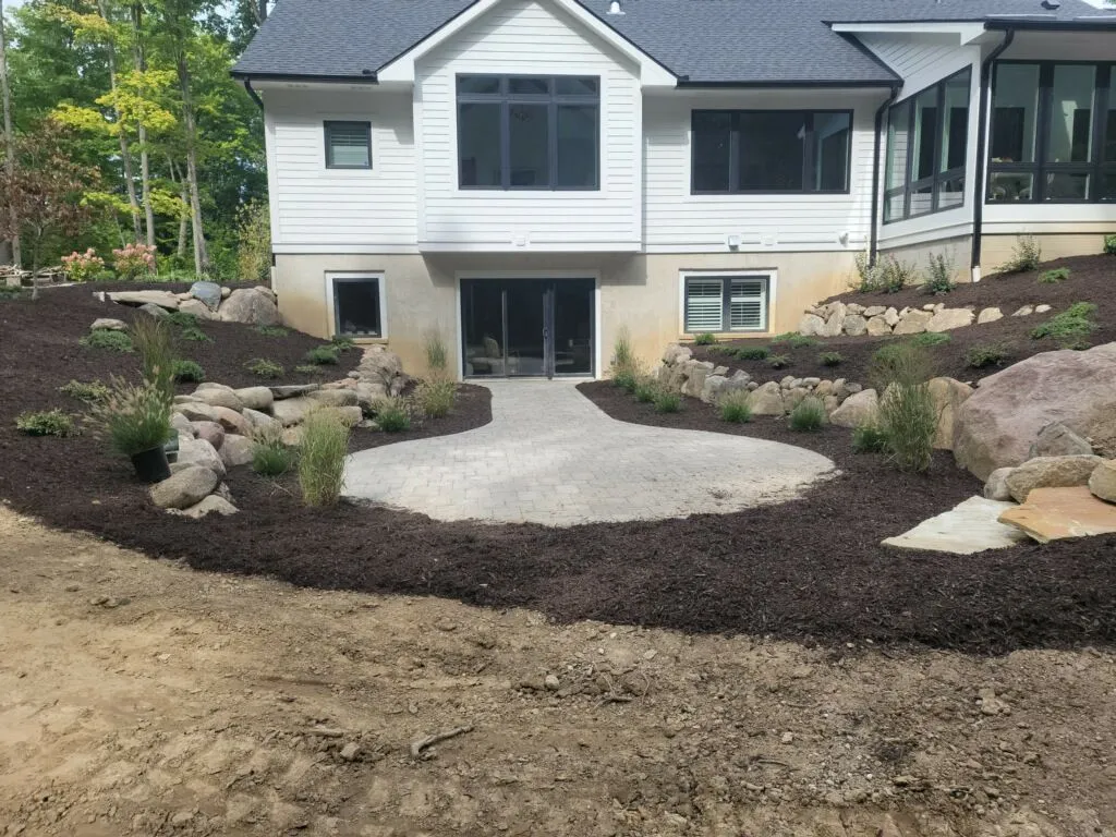 Hardscape patio with retaining walls in a finished landscape