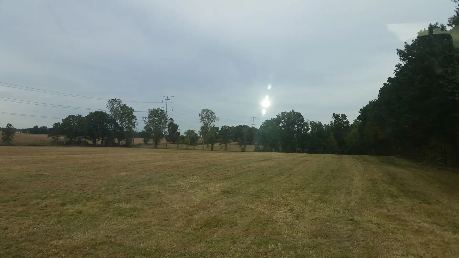 Large field mowed clean by KBK Landscaping crews near Ann Arbor