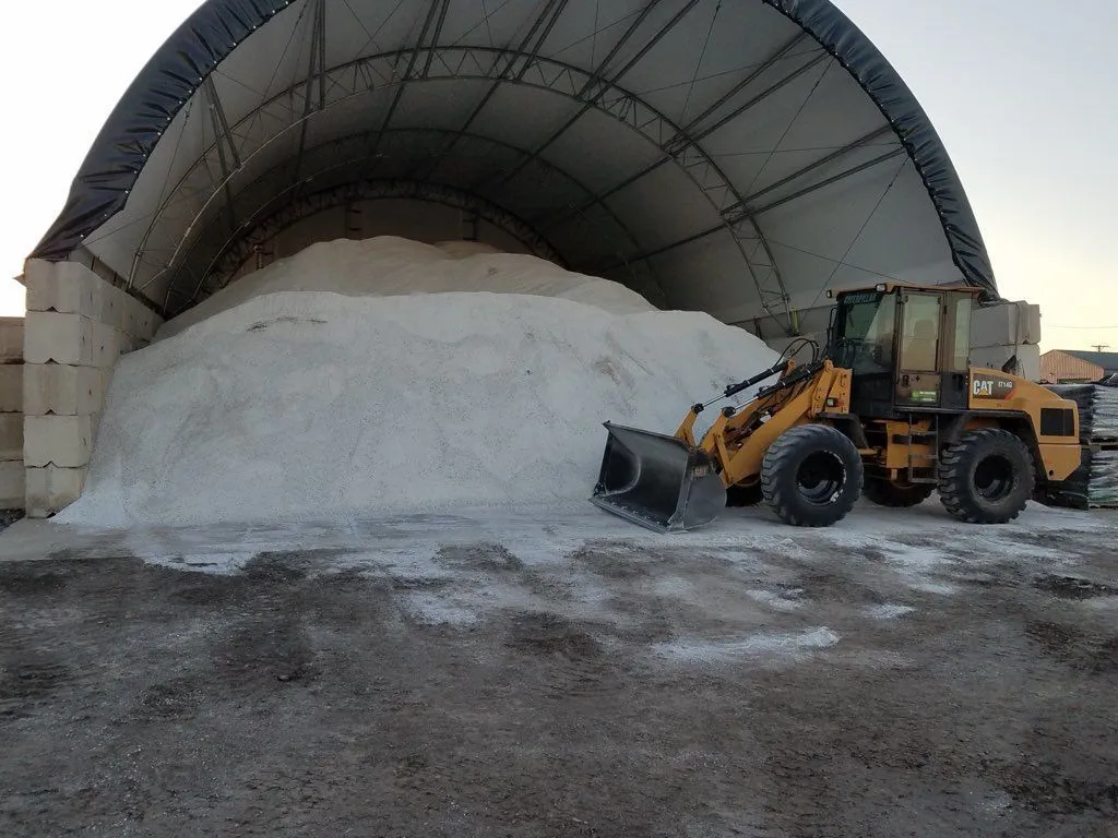 Snow-covered commercial drive cleared for winter access