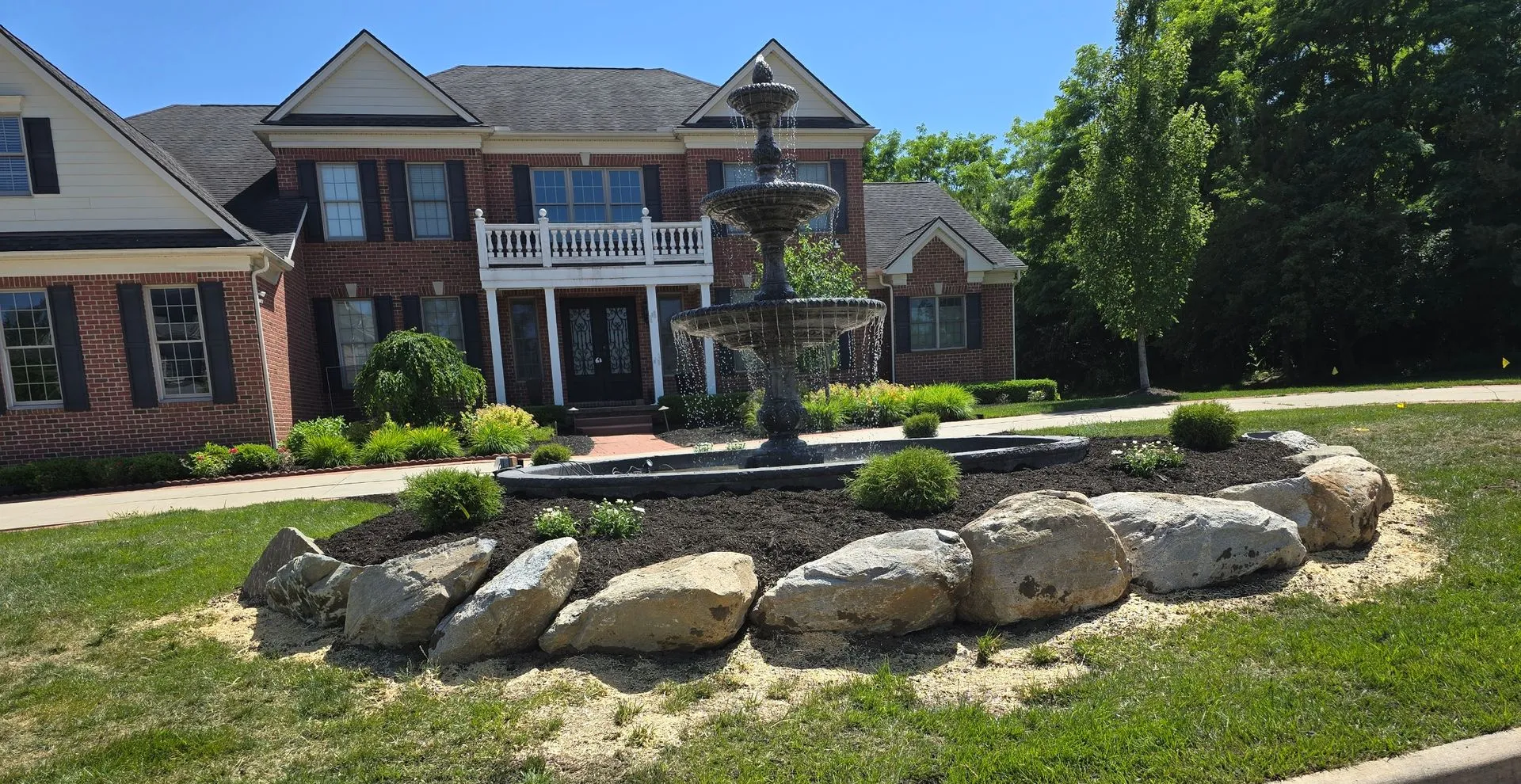 Natural stone hardscape wall and steps built by KBK Landscaping