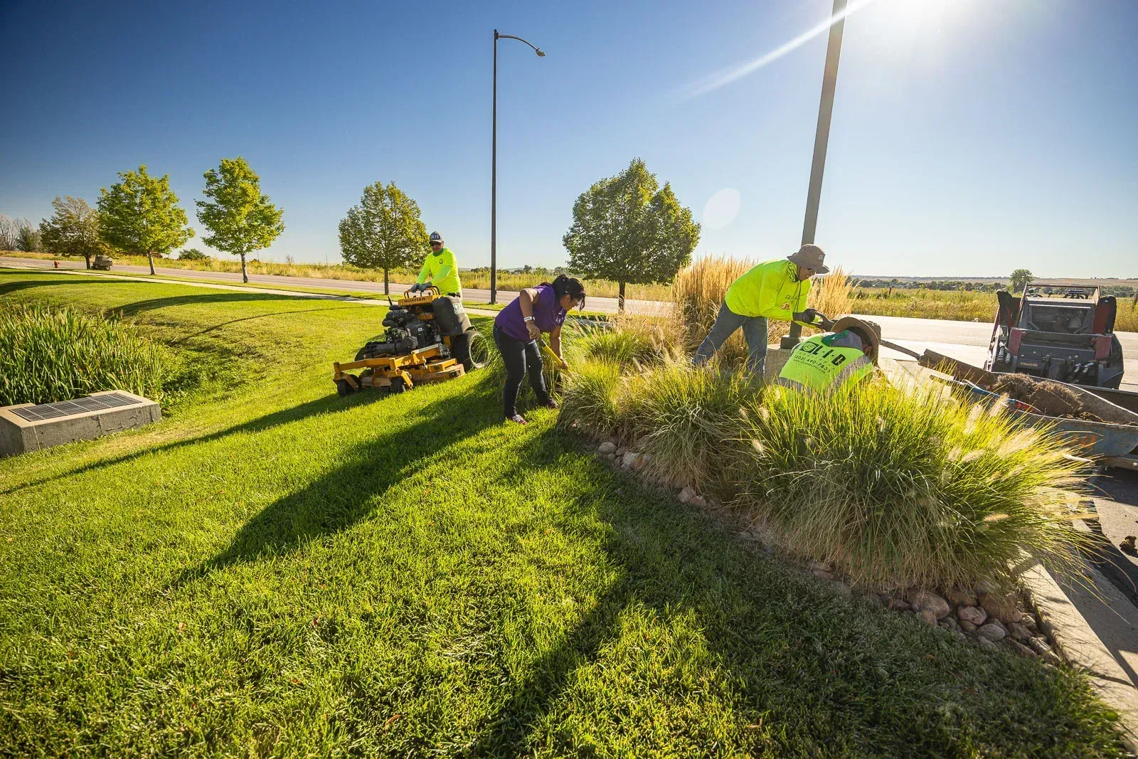Landscape crew planting and maintaining a designed commercial property