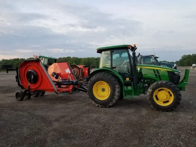 John Deere tractor with a flail mower attachment